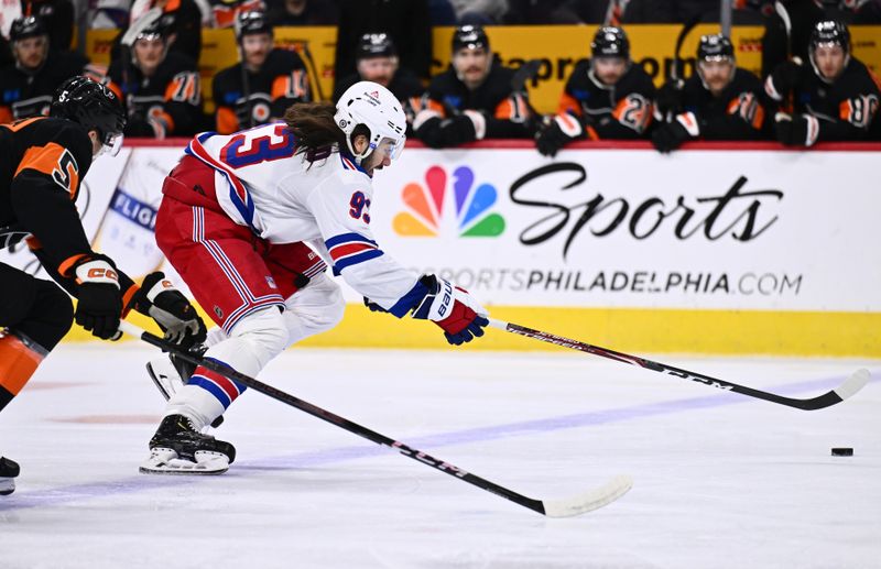 Nov 24, 2023; Philadelphia, Pennsylvania, USA; New York Rangers center Mika Zibanejad (93) reaches for the puck against the Philadelphia Flyers in the first period at Wells Fargo Center. Mandatory Credit: Kyle Ross-USA TODAY Sports