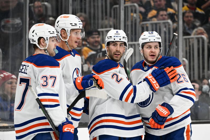 Mar 9, 2023; Boston, Massachusetts, USA; Edmonton Oilers defenseman Evan Bouchard (2) celebrates with center Mattias Janmark (26), left wing Warren Foegele (37) and center Nick Bjugstad (72) after scoring a goal against the Boston Bruins during the second period at the TD Garden. Mandatory Credit: Brian Fluharty-USA TODAY Sports