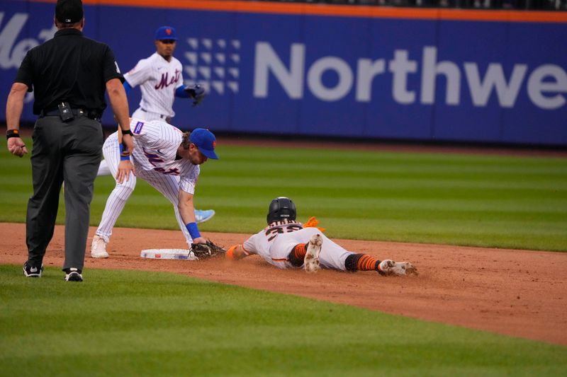 Jul 2, 2023; New York City, New York, USA;  New York Mets second baseman Jeff McNeil (1) tugs out San Francisco Giants second baseman Thairo Estrada (39) afttempint to steal second base during the third inning at Citi Field. Mandatory Credit: Gregory Fisher-USA TODAY Sports