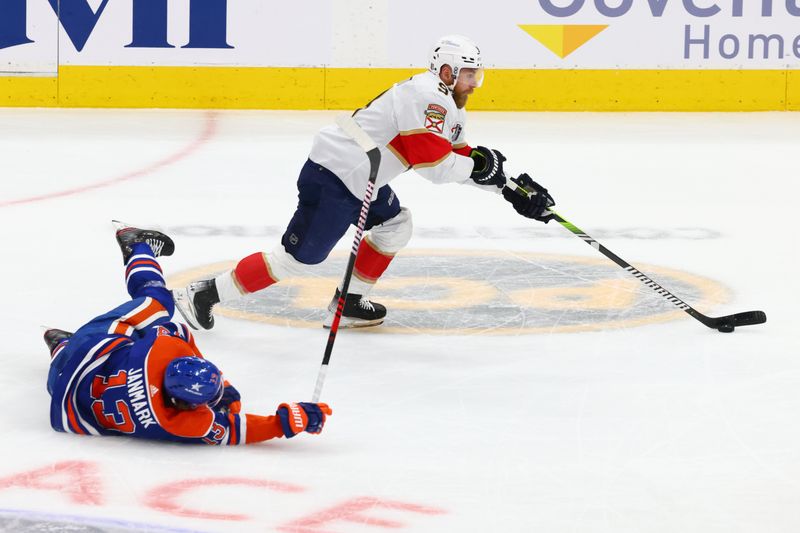 Jun 15, 2024; Edmonton, Alberta, CAN; Florida Panthers center Sam Bennett (9) skates passed Edmonton Oilers center Adam Henrique (19) in the first period in game four of the 2024 Stanley Cup Final at Rogers Place. Mandatory Credit: Sergei Belski-USA TODAY Sports