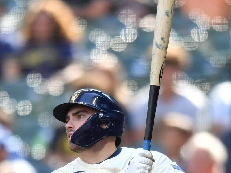 Jul 9, 2025; Milwaukee, Wisconsin, USA; Milwaukee Brewers third baseman Caleb Durbin (21) hits a single during the ninth inning against the Los Angeles Dodgers at American Family Field. Mandatory Credit: Patrick Gorski-Imagn Images