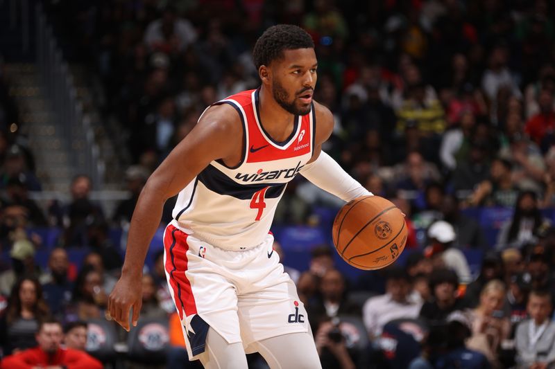 WASHINGTON, DC -? OCTOBER 24: Jared Butler #4 of the Washington Wizards handles the ball during the game against the Boston Celtics on October 24, 2024 at Capital One Arena in Washington, DC. NOTE TO USER: User expressly acknowledges and agrees that, by downloading and or using this Photograph, user is consenting to the terms and conditions of the Getty Images License Agreement. Mandatory Copyright Notice: Copyright 2024 NBAE (Photo by Kenny Giarla/NBAE via Getty Images)