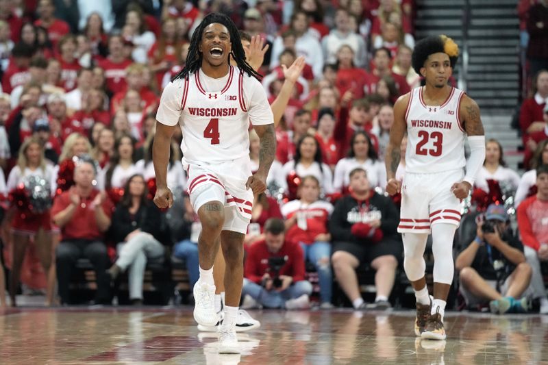 Nov 17, 2023; Madison, Wisconsin, USA; Wisconsin Badgers guard Kamari McGee (4) celebrates a foul call during the second half against the Robert Morris Colonials at the Kohl Center. Mandatory Credit: Kayla Wolf-USA TODAY Sports