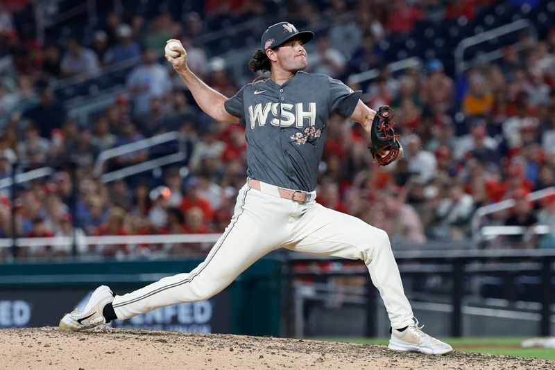 Jul 20, 2024; Washington, District of Columbia, USA; Washington Nationals relief pitcher Kyle Finnegan (67) pitches against the Cincinnati Reds during the ninth inning at Nationals Park. Mandatory Credit: Geoff Burke-USA TODAY Sports
