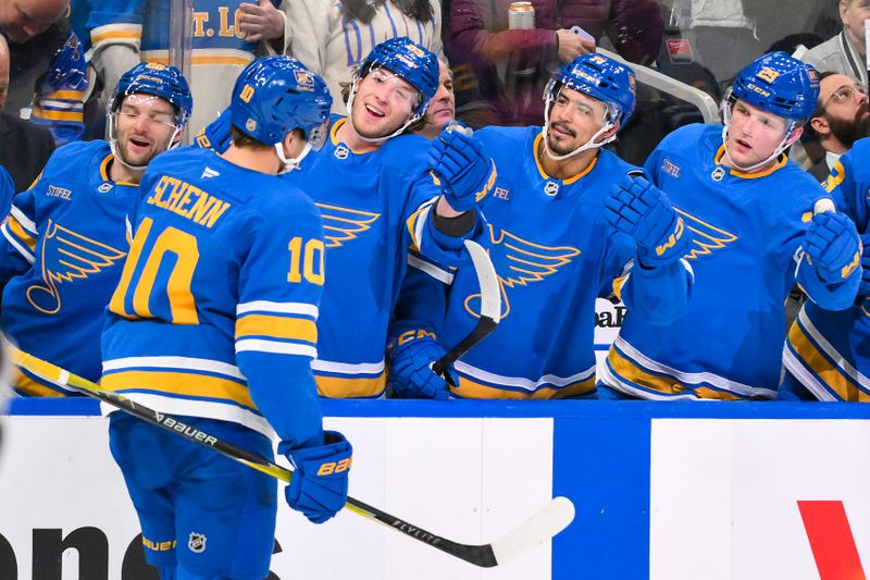 Jan 24, 2026; St. Louis, Missouri, USA; St. Louis Blues center Brayden Schenn (10) is congratulated by teammates after scoring against the Los Angeles Kings during the second period at Enterprise Center. Mandatory Credit: Jeff Curry-Imagn Images