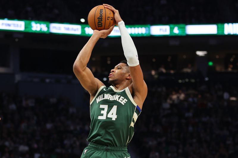 MILWAUKEE, WISCONSIN - DECEMBER 21: Giannis Antetokounmpo #34 of the Milwaukee Bucks takes a shot during the first half of a game against the Orlando Magic at Fiserv Forum on December 21, 2023 in Milwaukee, Wisconsin. NOTE TO USER: User expressly acknowledges and agrees that, by downloading and or using this photograph, User is consenting to the terms and conditions of the Getty Images License Agreement. (Photo by Stacy Revere/Getty Images)