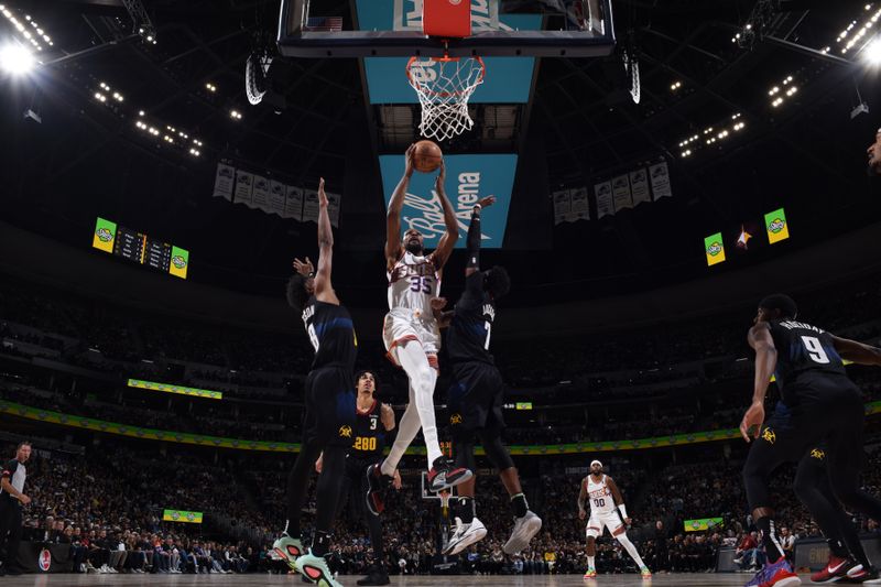 DENVER, CO - MARCH 27: Kevin Durant #35 of the Phoenix Suns dunks the ball during the game against the Denver Nuggets on March 27, 2023 at the Ball Arena in Denver, Colorado. NOTE TO USER: User expressly acknowledges and agrees that, by downloading and/or using this Photograph, user is consenting to the terms and conditions of the Getty Images License Agreement. Mandatory Copyright Notice: Copyright 2024 NBAE (Photo by Garrett Ellwood/NBAE via Getty Images)