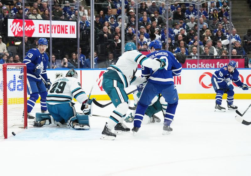 Jan 9, 2024; Toronto, Ontario, CAN; Toronto Maple Leafs left wing Nicholas Robertson (89) scores a goal against the San Jose Sharks during the third period at Scotiabank Arena. Mandatory Credit: Nick Turchiaro-USA TODAY Sports