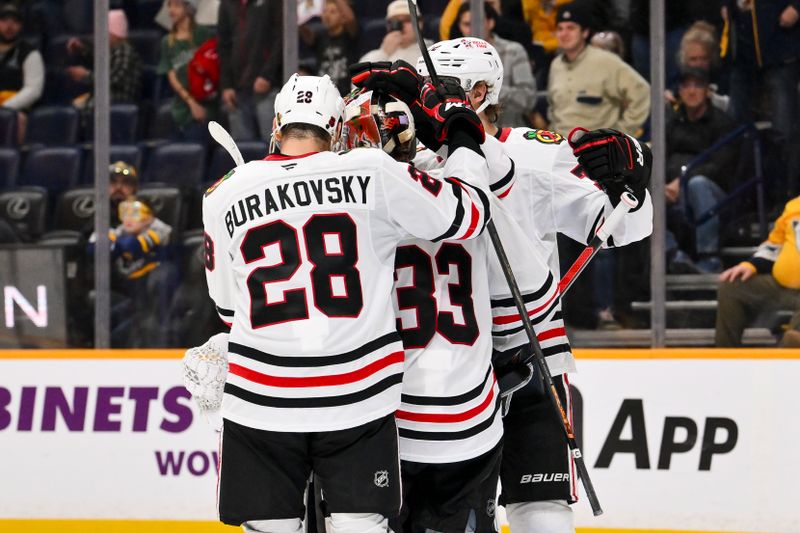 Jan 10, 2026; Nashville, Tennessee, USA;  Chicago Blackhawks goaltender Drew Commesso (33) celebrates the win with his teammates against the Nashville Predators during the third period at Bridgestone Arena. Mandatory Credit: Steve Roberts-Imagn Images