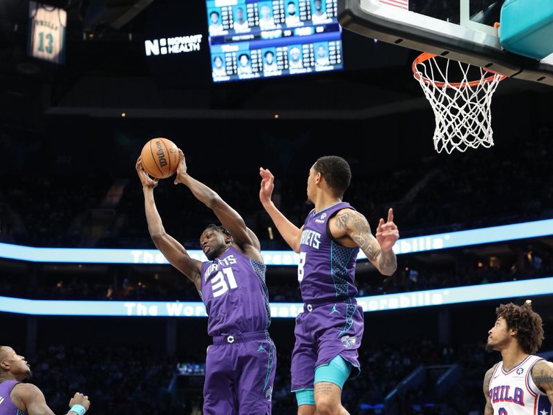 CHARLOTTE, NC - JANUARY 20:  Nathan Mensah #31 of the Charlotte Hornets grabs the rebound during the game on January 20, 2024 at Spectrum Center in Charlotte, North Carolina. NOTE TO USER: User expressly acknowledges and agrees that, by downloading and or using this photograph, User is consenting to the terms and conditions of the Getty Images License Agreement.  Mandatory Copyright Notice:  Copyright 2024 NBAE (Photo by Brock Williams-Smith/NBAE via Getty Images)