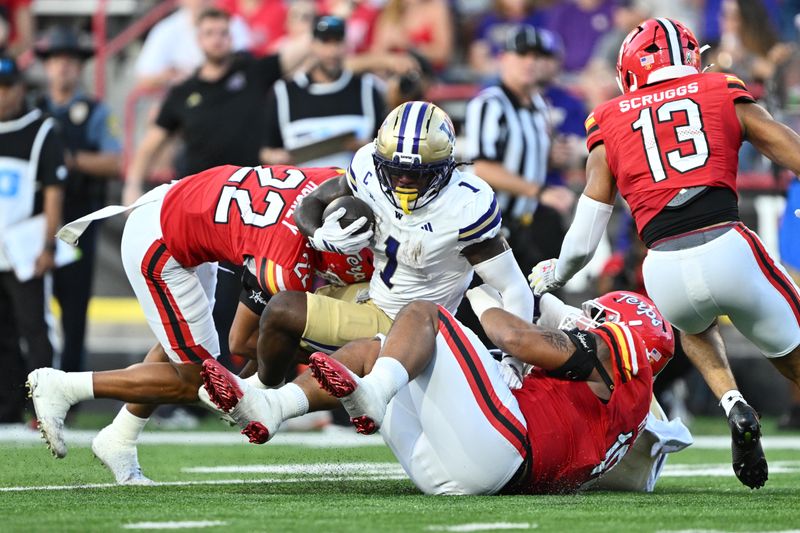Oct 4, 2025; College Park, Maryland, USA;  Washington Huskies running back Jonah Coleman (1) is brought down after picking up a first down in the second half against the Maryland Terrapins at SECU Stadium. Mandatory Credit: Jamie Sabau-Imagn Images