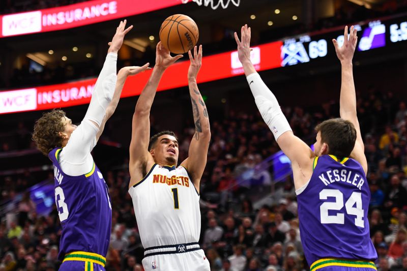 SALT LAKE CITY, UTAH - JANUARY 10: Michael Porter Jr. #1 of the Denver Nuggets shoots against Lauri Markkanen #23 and Walker Kessler #24 of the Utah Jazz during the second half at Delta Center on January 10, 2024 in Salt Lake City, Utah.  NOTE TO USER: User expressly acknowledges and agrees that, by downloading and or using this photograph, User is consenting to the terms and conditions of the Getty Images License Agreement. (Photo by Alex Goodlett/Getty Images)