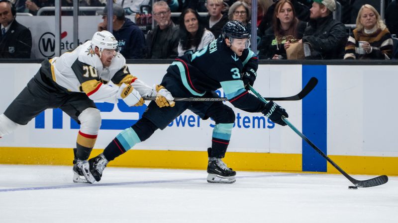 Nov 8, 2024; Seattle, Washington, USA;  Seattle Kraken defenseman Will Borgen (3) skates against Vegas Golden Knights forward Tanner Pearson (70) during the first period at Climate Pledge Arena. Mandatory Credit: Stephen Brashear-Imagn Images