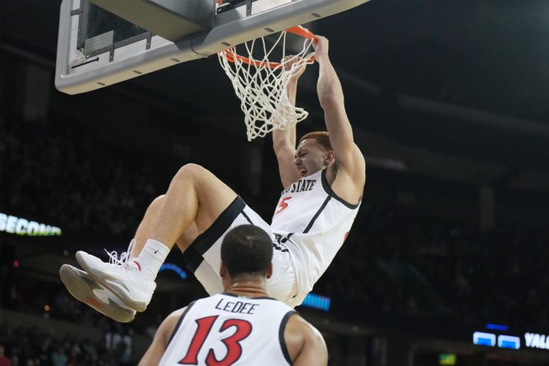 Mar 24, 2024; Spokane, WA, USA; San Diego State Aztecs forward Elijah Saunders (25) dunks the ball in the first half against the Yale Bulldogs at Spokane Veterans Memorial Arena. Mandatory Credit: Kirby Lee-USA TODAY Sports