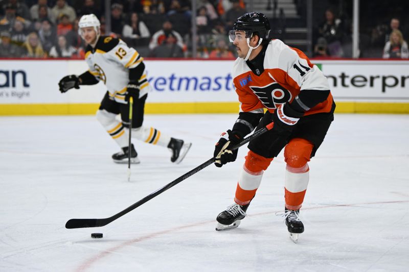 Nov 2, 2024; Philadelphia, Pennsylvania, USA; Philadelphia Flyers right wing Travis Konecny (11) controls the puck against the Boston Bruins in the first period at Wells Fargo Center. Mandatory Credit: Kyle Ross-Imagn Images