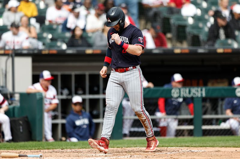 Sep 17, 2023; Chicago, Illinois, USA; Minnesota Twins catcher Ryan Jeffers (27) scores against the Chicago White Sox during the fifth inning at Guaranteed Rate Field. Mandatory Credit: Kamil Krzaczynski-USA TODAY Sports