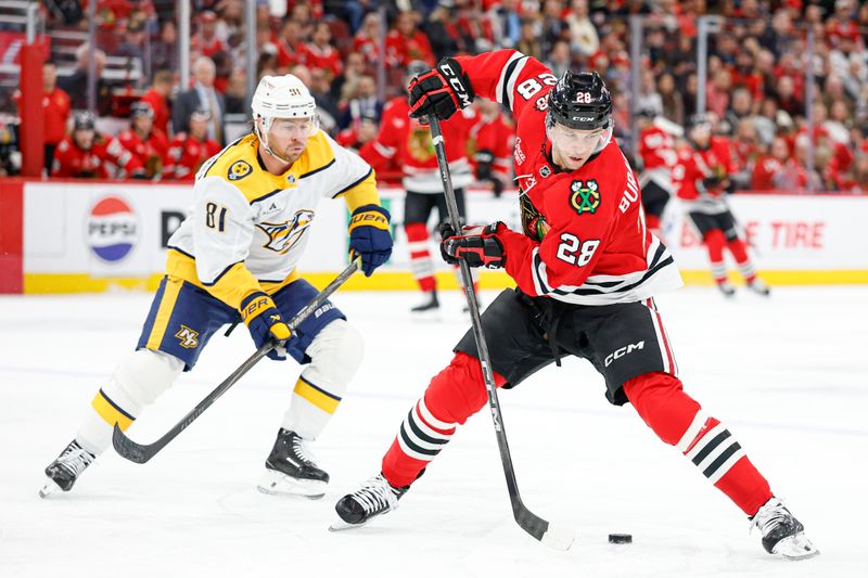 Mar 22, 2026; Chicago, Illinois, USA; Chicago Blackhawks left wing Andre Burakovsky (28) controls the puck against Nashville Predators center Jonathan Marchessault (81) during the first period at United Center. Mandatory Credit: Kamil Krzaczynski-Imagn Images