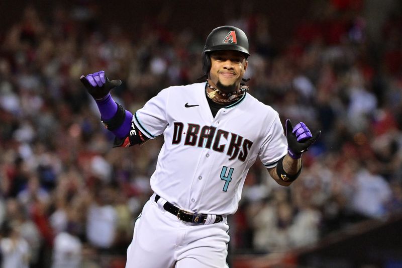 Oct 11, 2023; Phoenix, Arizona, USA; Arizona Diamondbacks shortstop Geraldo Perdomo (2) reacts after hitting a home run against the Los Angeles Dodgers in the third inning for game three of the NLDS for the 2023 MLB playoffs at Chase Field. Mandatory Credit: Matt Kartozian-USA TODAY Sports