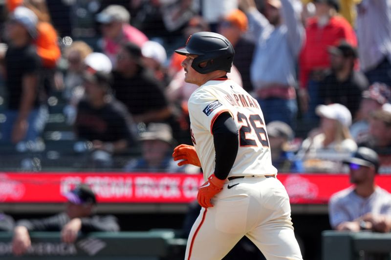 May 3, 2025; San Francisco, California, USA; San Francisco Giants third baseman Matt Chapman (26) watches the flight of his grand slam home run against the Colorado Rockies during the sixth inning at Oracle Park. Mandatory Credit: Darren Yamashita-Imagn Images