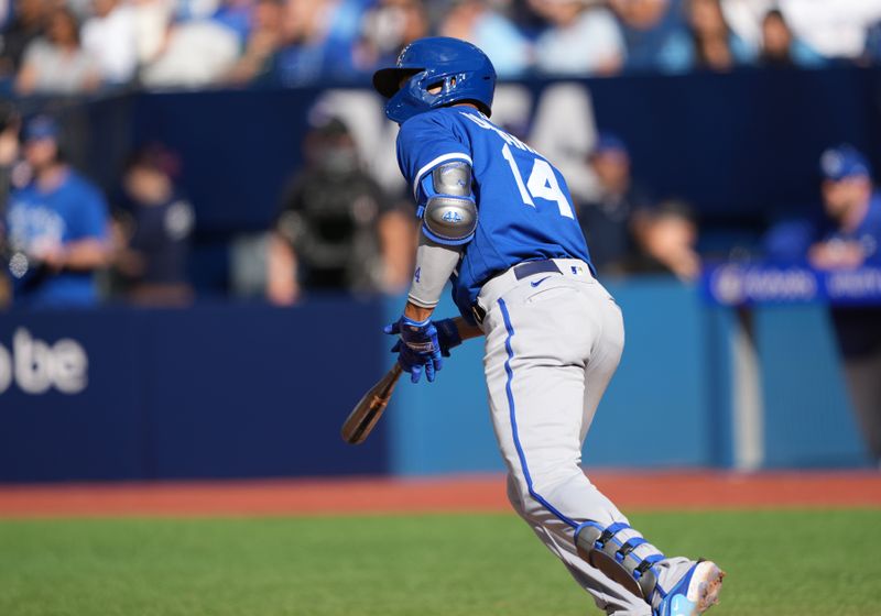 Sep 10, 2023; Toronto, Ontario, CAN; Kansas City Royals designated hitter Edward Olivares (14) hits a single against the Toronto Blue Jays during the ninth inning at Rogers Centre. Mandatory Credit: Nick Turchiaro-USA TODAY Sports