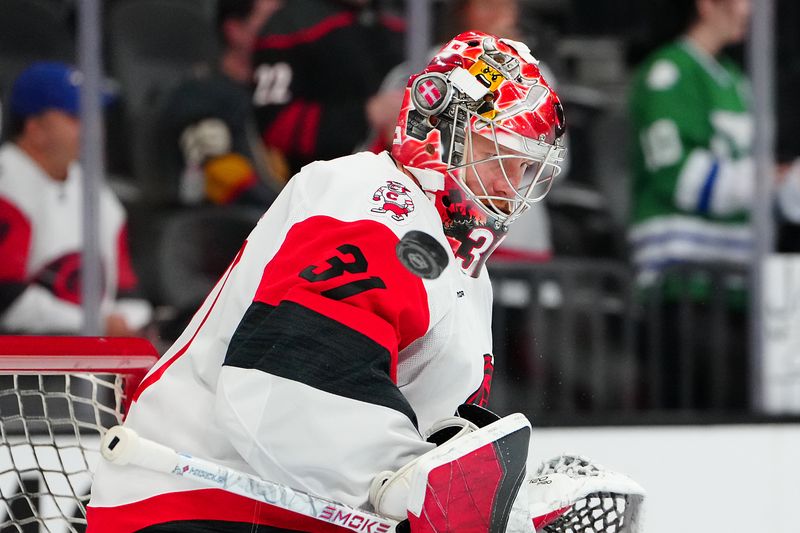 Oct 20, 2025; Las Vegas, Nevada, USA;Carolina Hurricanes goaltender Frederik Anderson (31) warms up before a game against the Vegas Golden Knights at T-Mobile Arena. Mandatory Credit: Stephen R. Sylvanie-Imagn Images