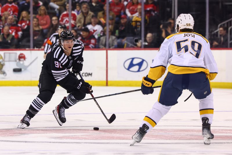 Nov 25, 2024; Newark, New Jersey, USA; New Jersey Devils center Dawson Mercer (91) skates with the puck while being defended by Nashville Predators defenseman Roman Josi (59) during the second period at Prudential Center. Mandatory Credit: Ed Mulholland-Imagn Images