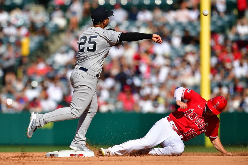 Jul 19, 2023; Anaheim, California, USA; Los Angeles Angels center fielder Mickey Moniak (16) is out at second as New York Yankees second baseman Gleyber Torres (25) is late on the throw to first during the fourth inning at Angel Stadium. Mandatory Credit: Gary A. Vasquez-USA TODAY Sports