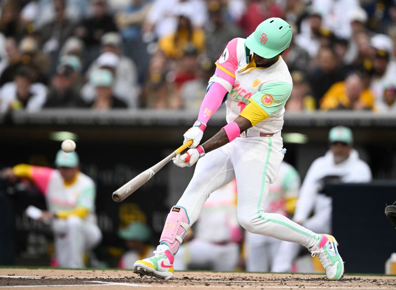 Jun 7, 2024; San Diego, California, USA; San Diego Padres left fielder Jurickson Profar (10) hits a solo home run during the first inning against the Arizona Diamondbacks at Petco Park. Mandatory Credit: Denis Poroy-USA TODAY Sports at Petco Park. 