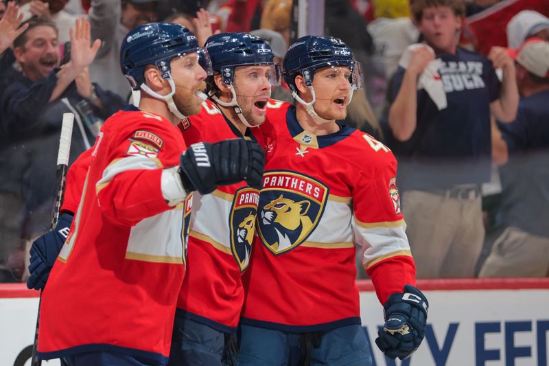 May 9, 2025; Sunrise, Florida, USA; Florida Panthers center Carter Verhaeghe (23) celebrates with center Sam Bennett (9) and defenseman Gustav Forsling (42) after scoring against the Toronto Maple Leafs during the second period in game three of the second round of the 2025 Stanley Cup Playoffs at Amerant Bank Arena. Mandatory Credit: Sam Navarro-Imagn Images