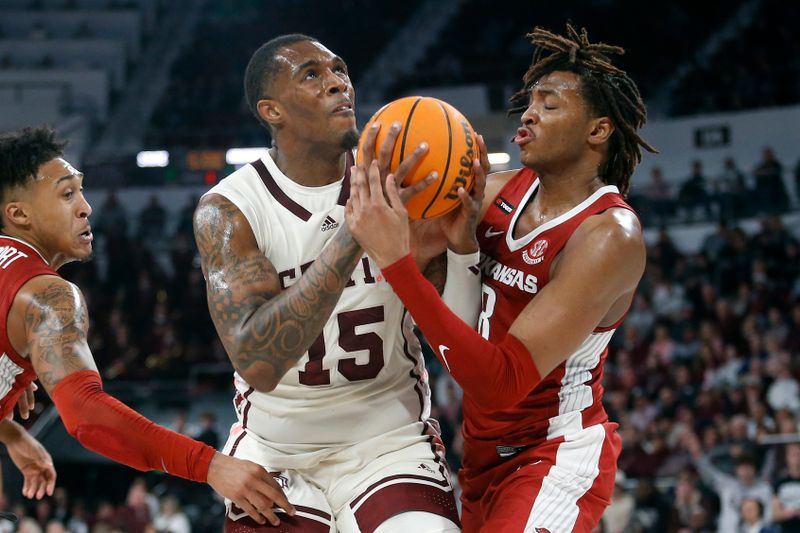 Feb 17, 2024; Starkville, Mississippi, USA; Mississippi State Bulldogs forward Jimmy Bell Jr. (15) and Arkansas Razorbacks forward Chandler Lawson (8) battle for a rebound during the first half at Humphrey Coliseum. Mandatory Credit: Petre Thomas-USA TODAY Sports