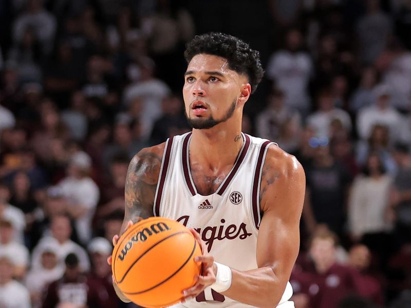 Dec 6, 2023; College Station, Texas, USA; Texas A&M Aggies guard Jace Carter (0) shoots a three-point shot against the DePaul Blue Demons during the first half at Reed Arena. Mandatory Credit: Erik Williams-USA TODAY Sports