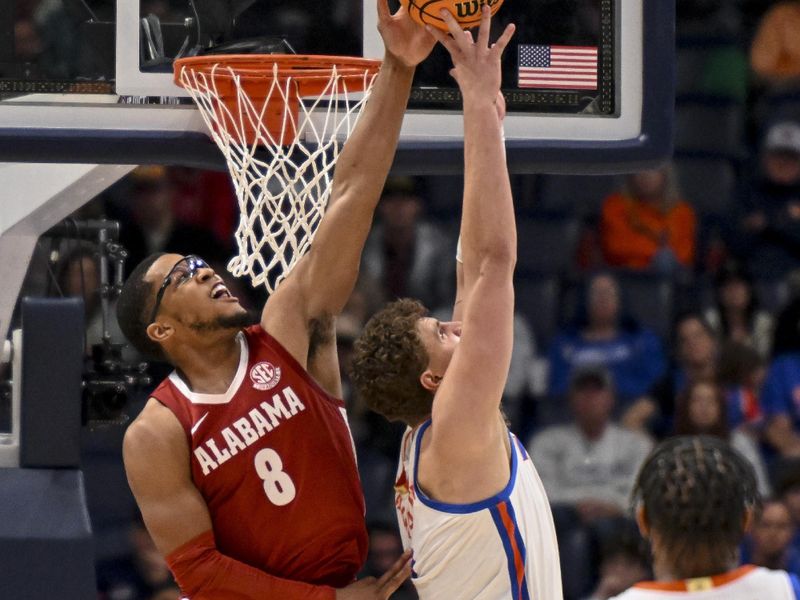 Mar 15, 2025; Nashville, TN, USA;  Alabama Crimson Tide guard Chris Youngblood (8) blocks the shot of  Florida Gators forward Thomas Haugh (10) during the second half at Bridgestone Arena. Mandatory Credit: Steve Roberts-Imagn Images