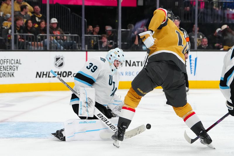 Nov 2, 2024; Las Vegas, Nevada, USA; Utah Hockey Club goaltender Connor Ingram (39) makes a save as Vegas Golden Knights center Nicolas Roy (10) looks for a rebound during the second period at T-Mobile Arena. Mandatory Credit: Stephen R. Sylvanie-Imagn Images