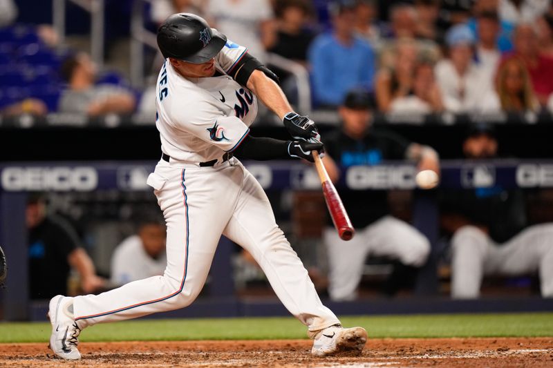 Jun 20, 2023; Miami, Florida, USA; Miami Marlins catcher Nick Fortes (4) hits a double against the Toronto Blue Jays during the eighth inning at loanDepot Park. Mandatory Credit: Rich Storry-USA TODAY Sports