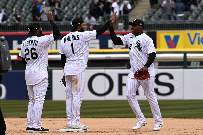 Apr 5, 2023; Chicago, Illinois, USA;  Chicago White Sox second baseman Elvis Andrus (1) high fives Chicago White Sox center fielder Oscar Colas (22) after the game against the San Francisco Giants during the ninth inning at Guaranteed Rate Field. Mandatory Credit: Matt Marton-USA TODAY Sports