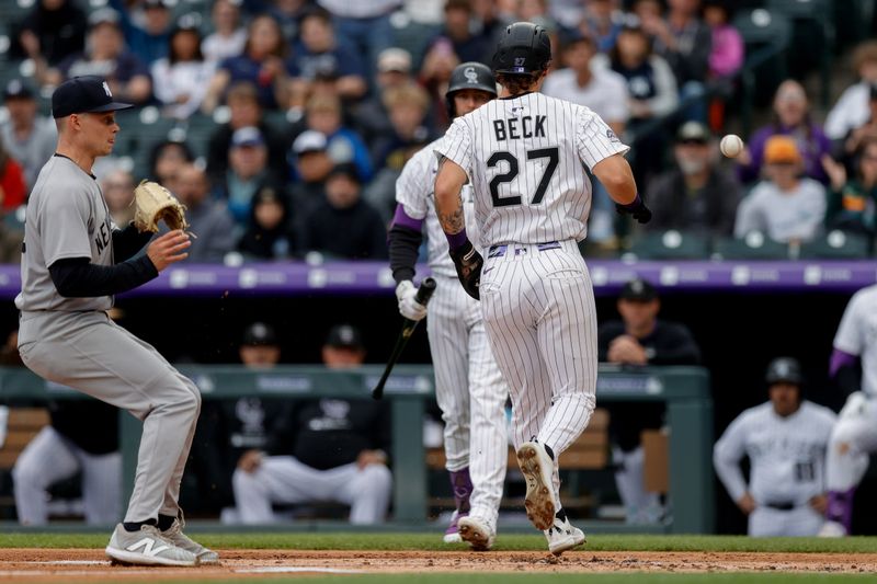 May 25, 2025; Denver, Colorado, USA; Colorado Rockies left fielder Jordan Beck (27) scores on a wild pitch against New York Yankees starting pitcher Will Warren (98) in the first inning at Coors Field. Mandatory Credit: Isaiah J. Downing-Imagn Images