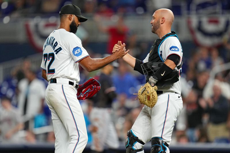 Apr 4, 2023; Miami, Florida, USA;  Miami Marlins starting pitcher Sandy Alcantara (22) shakes hands with catcher Jacob Stallings (58) after a complete game over the Minnesota Twins at loanDepot Park. Mandatory Credit: Jim Rassol-USA TODAY Sports