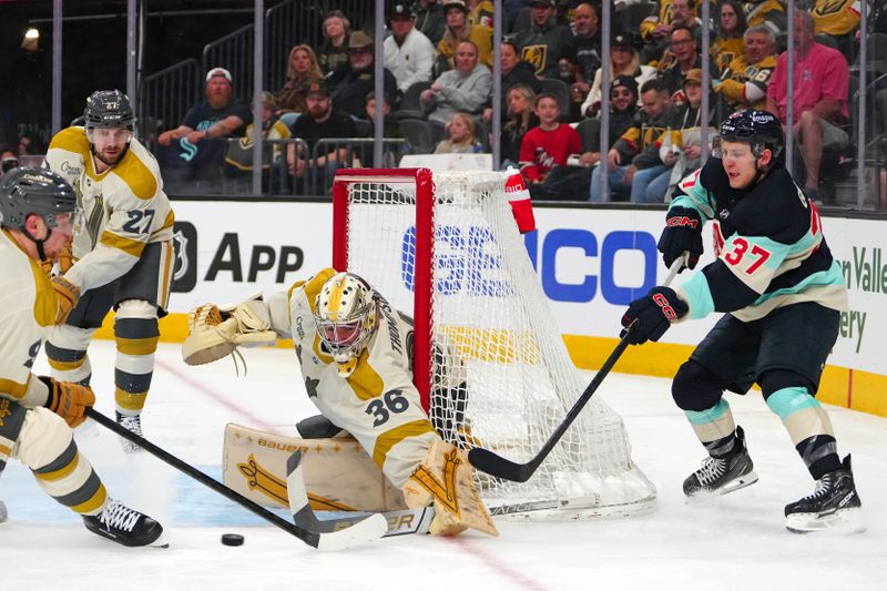 Mar 21, 2024; Las Vegas, Nevada, USA; Seattle Kraken center Yanni Gourde (37) centers the puck past Vegas Golden Knights goaltender Logan Thompson (36) and Vegas Golden Knights center Jack Eichel (9) during the third period at T-Mobile Arena. Mandatory Credit: Stephen R. Sylvanie-USA TODAY Sports