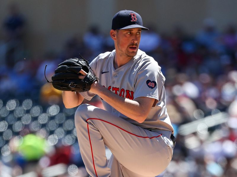 May 5, 2024; Minneapolis, Minnesota, USA; Boston Red Sox starting pitcher Cooper Criswell (64) delivers a pitch against the Minnesota Twins during the first inning at Target Field. Mandatory Credit: Matt Krohn-USA TODAY Sports