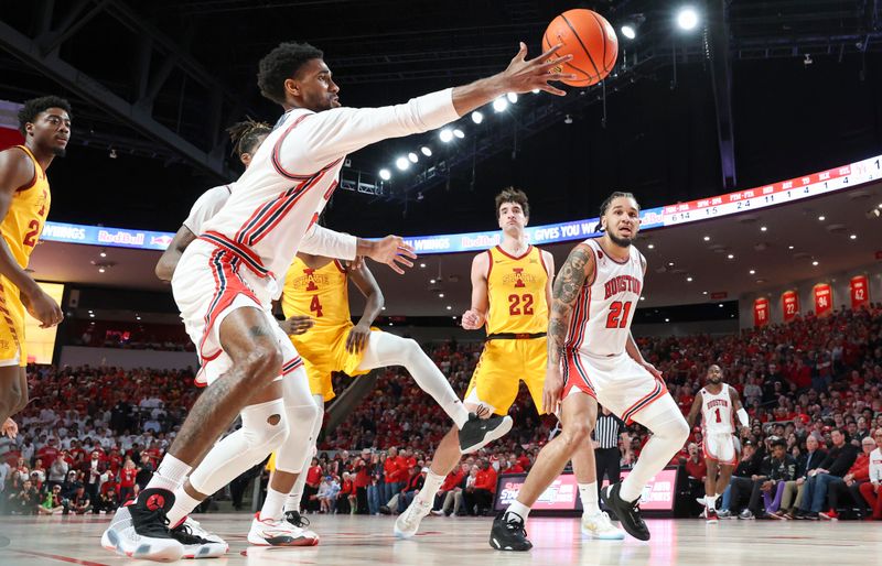 Feb 19, 2024; Houston, Texas, USA; Houston Cougars guard Mylik Wilson (8) attempts to get control of the ball during the first half against the Iowa State Cyclones at Fertitta Center. Mandatory Credit: Troy Taormina-USA TODAY Sports