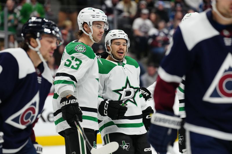 Feb 27, 2024; Denver, Colorado, USA; Dallas Stars center Logan Stankoven (11) celebrates his goal with center Wyatt Johnston (53) in the first period against the Colorado Avalanche at Ball Arena. Mandatory Credit: Ron Chenoy-USA TODAY Sports