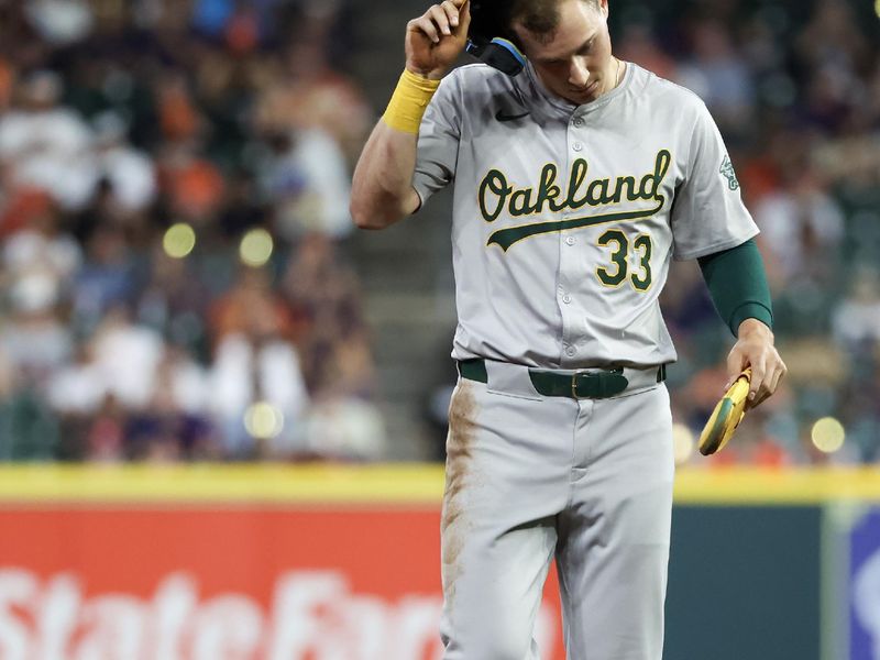 May 15, 2024; Houston, Texas, USA; Oakland Athletics outfielder JJ Bleday (33) walks from second base to the dugout after being left on base against the Houston Astros  in the eighth inning at Minute Maid Park. Mandatory Credit: Thomas Shea-USA TODAY Sports