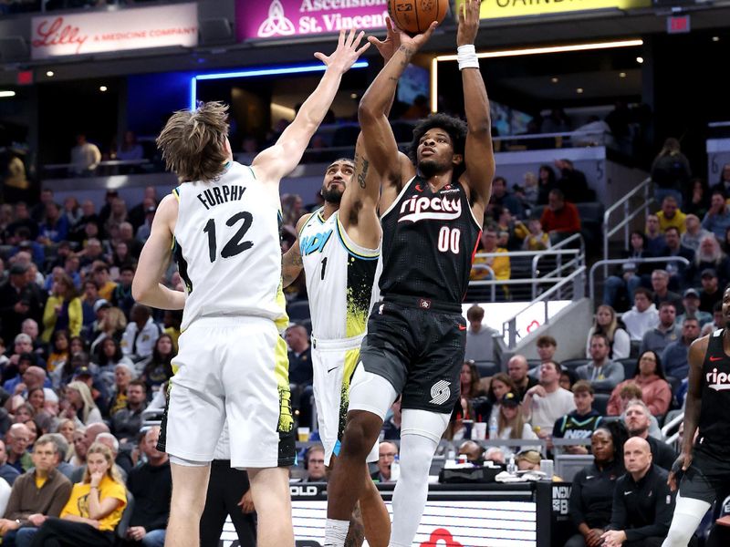 INDIANAPOLIS, INDIANA - NOVEMBER 27: Scoot Henderson #00 of the Portland Trailblazers shoots the ball while defended by Johnny Furphy #12 of the Indiana Pacers at Gainbridge Fieldhouse on November 27, 2024 in Indianapolis, Indiana.<p><br/></p>NOTE TO USER: User expressly acknowledges and agrees that, by downloading and or using this photograph, User is consenting to the terms and conditions of the Getty Images License Agreement. (Photo by Andy Lyons/Getty Images)