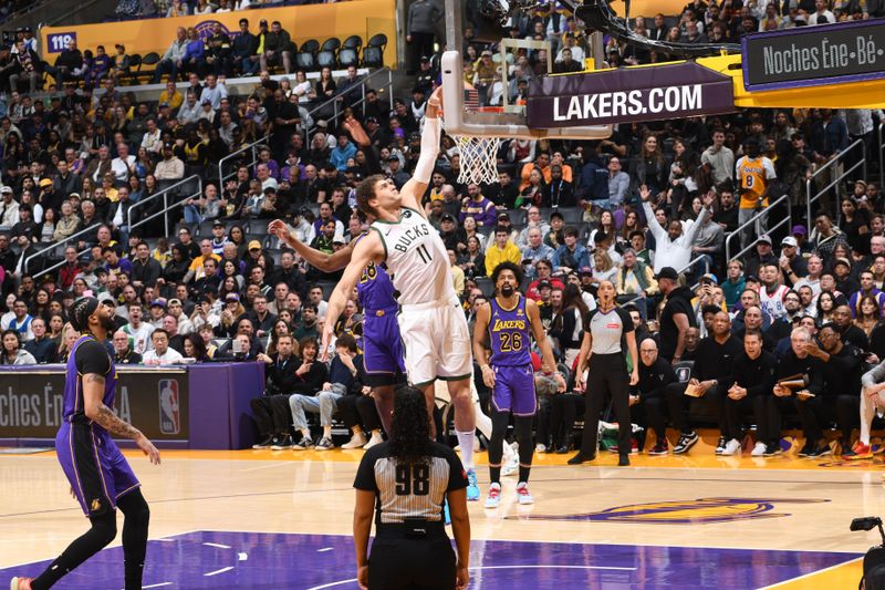 LOS ANGELES, CA - MARCH 8: Brook Lopez #11 of the Milwaukee Bucks dunks the ball during the game against the Los Angeles Lakers on March 8, 2024 at Crypto.Com Arena in Los Angeles, California. NOTE TO USER: User expressly acknowledges and agrees that, by downloading and/or using this Photograph, user is consenting to the terms and conditions of the Getty Images License Agreement. Mandatory Copyright Notice: Copyright 2024 NBAE (Photo by Andrew D. Bernstein/NBAE via Getty Images)