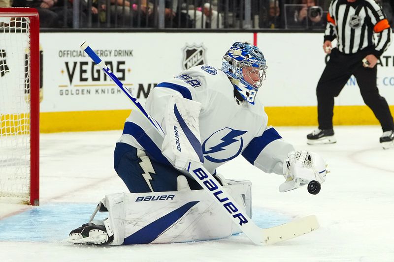 Mar 19, 2024; Las Vegas, Nevada, USA; Tampa Bay Lightning goaltender Andrei Vasilevskiy (88) makes a save against the Vegas Golden Knights during the second period at T-Mobile Arena. Mandatory Credit: Stephen R. Sylvanie-USA TODAY Sports