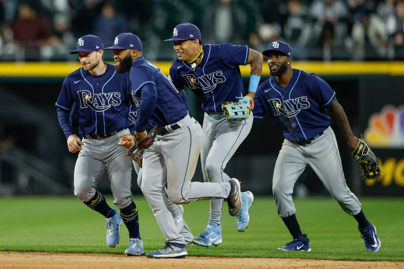 Apr 28, 2023; Chicago, Illinois, USA; Tampa Bay Rays players celebrate team's win against the Chicago White Sox during the ninth inning at Guaranteed Rate Field. Mandatory Credit: Kamil Krzaczynski-USA TODAY Sports