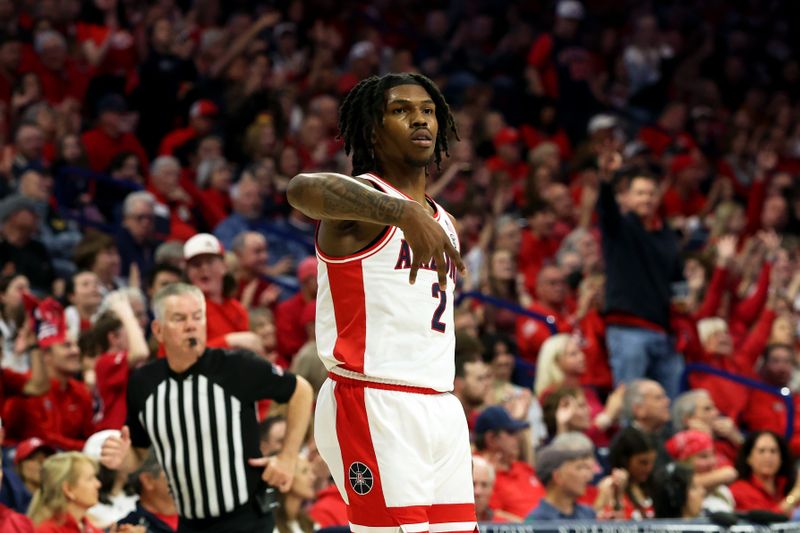 Feb 17, 2024; Tucson, Arizona, USA; Arizona Wildcats guard Caleb Love (2) makes a three point basket against Arizona State Sun Devils then celebrates with a forks down with the Arizona Wildcats bench during the first half at McKale Center. Mandatory Credit: Zachary BonDurant-USA TODAY Sports