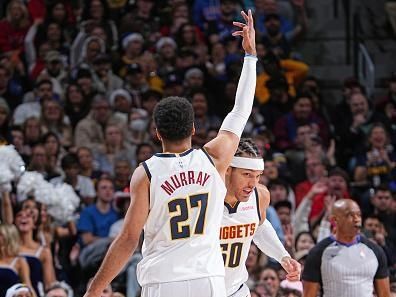 DENVER, CO - DECEMBER 25: Jamal Murray #27 of the Denver Nuggets celebrates during the game against the Golden State Warriors on December 25, 2023 at the Ball Arena in Denver, Colorado. NOTE TO USER: User expressly acknowledges and agrees that, by downloading and/or using this Photograph, user is consenting to the terms and conditions of the Getty Images License Agreement. Mandatory Copyright Notice: Copyright 2023 NBAE (Photo by Garrett Ellwood/NBAE via Getty Images)