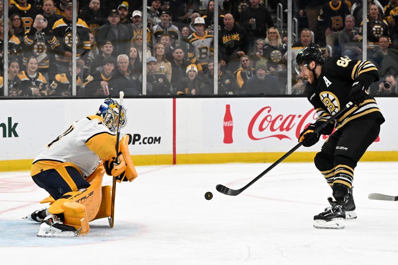 Oct 14, 2023; Boston, Massachusetts, USA; Boston Bruins right wing David Pastrnak (88) attempts a shot against Nashville Predators goaltender Juuse Saros (74) during the second period at the TD Garden. Mandatory Credit: Brian Fluharty-USA TODAY Sports