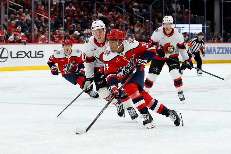Oct 25, 2025; Washington, District of Columbia, USA; Washington Capitals right wing Justin Sourdif (34) skates with the puck against as Ottawa Senators left wing Fabian Zetterlund (20) chases during the third period at Capital One Arena. Mandatory Credit: Geoff Burke-Imagn Images
